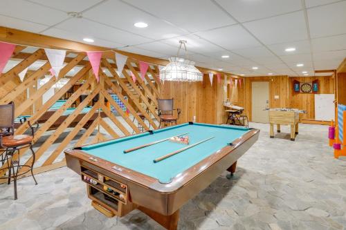 a pool table in a room with wooden walls at 3 Mi to Colgate Lake Mtn-View Home, Deck and Grill! in East Jewett