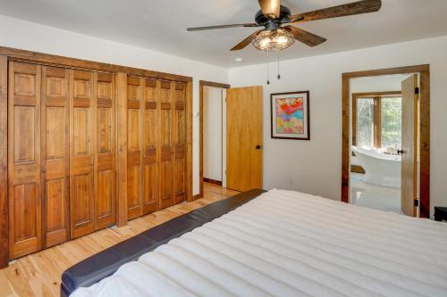 a bedroom with a bed and a ceiling fan at 3 Mi to Colgate Lake Mtn-View Home, Deck and Grill! in East Jewett