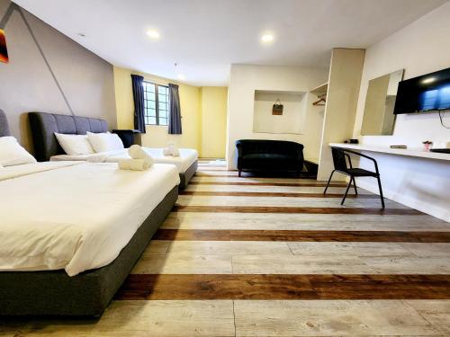 Ένα ή περισσότερα κρεβάτια σε δωμάτιο στο Gohtong Jaya Family Room 5min to Genting Outlet