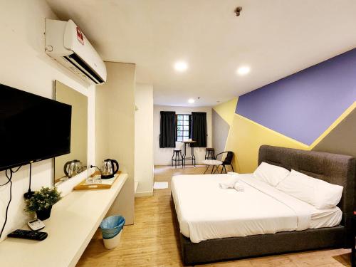 Μια τηλεόραση ή/και κέντρο ψυχαγωγίας στο Gohtong Jaya Family Room 5min to Genting Outlet