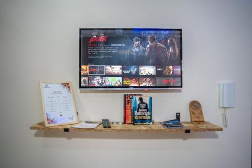 a flat screen tv hanging on a wall at Med Stay Apartment with amazing Terrace - A2 in Tamraght Ouzdar