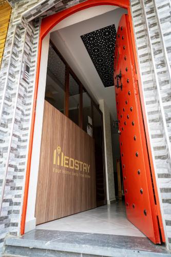 an entrance to a hospital with an orange door at Med Stay Apartment with amazing Terrace - A2 in Tamraght Ouzdar