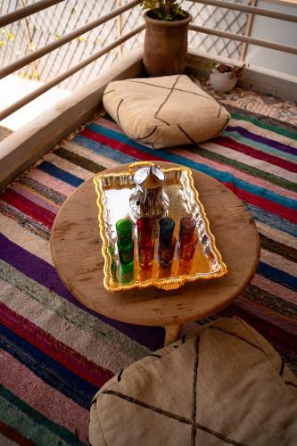a tray of drinks on a table on a floor at Med Stay Apartment with amazing Terrace - A2 in Tamraght Ouzdar