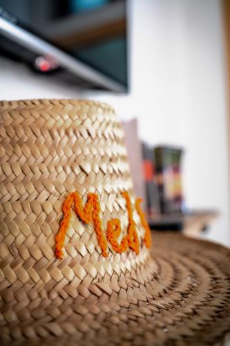 a cake with orange frosting on top of a table at Med Stay Apartment with amazing Terrace - A2 in Tamraght Ouzdar