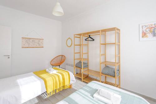 Postel nebo postele na pokoji v ubytování Sintra Sweet Apartments III - Free Parking