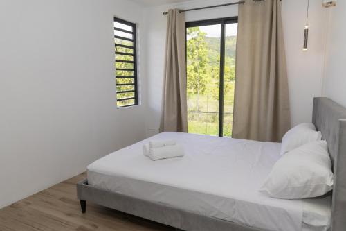 Postel nebo postele na pokoji v ubytování Palms studio