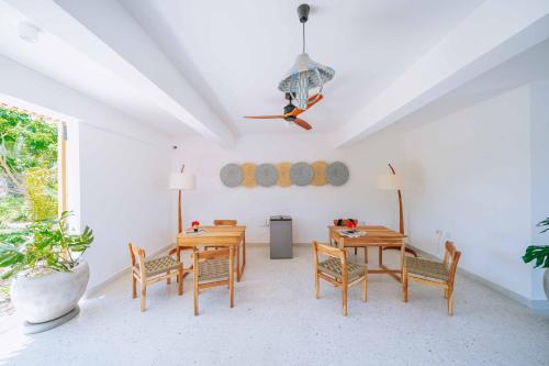 a dining room with a table and chairs at 1 BDR Garden Apartment at The Soul, Paje in Paje
