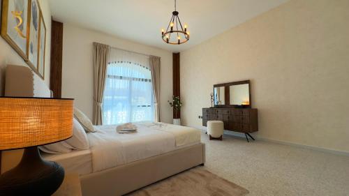 a bedroom with a bed and a window and a dresser at Dream 5BR Villa Escape - Premium Comfort Near Corniche & Abu Dhabi City Center in Abu Dhabi