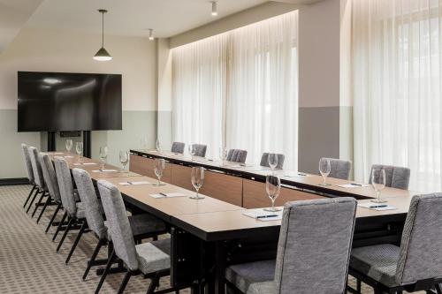 a large conference room with a long table and chairs at The Flat Iron Hotel in Asheville