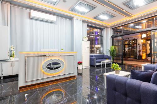 a lobby with a large screen in a building at Santa Rio Gold Taxim Hotel in Istanbul