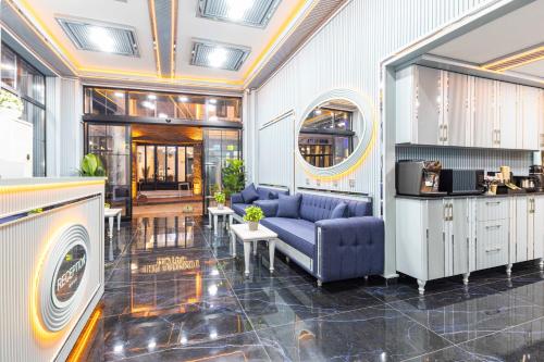 a living room with a couch and a table at Santa Rio Gold Taxim Hotel in Istanbul