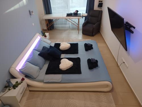 a bed in a room with two white pillows at Éva Apartmanház in Eger