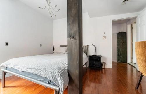 Ένα ή περισσότερα κρεβάτια σε δωμάτιο στο Le Loft