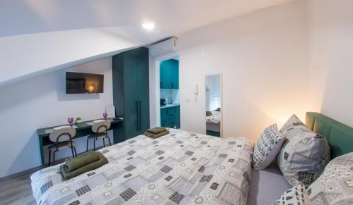 Postel nebo postele na pokoji v ubytování Maxim Apartments