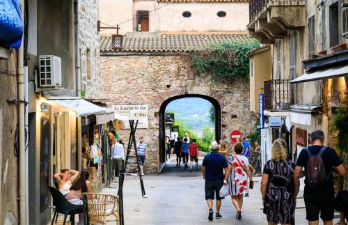 a group of people walking down a street at U Caseddu in Sotta