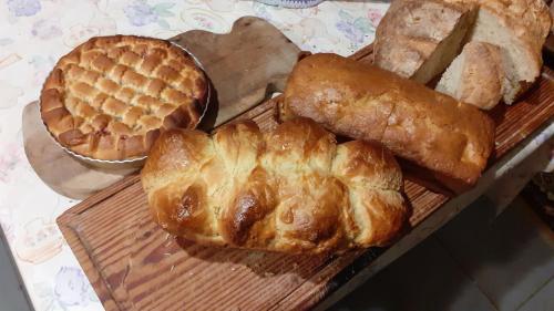 a bunch of different types of bread and pastries on a table at La Genotte in La Motte-dʼAveillans