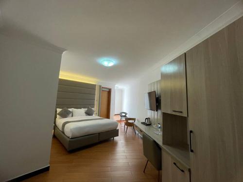 Ένα ή περισσότερα κρεβάτια σε δωμάτιο στο Hammer Luxury Guesthouse