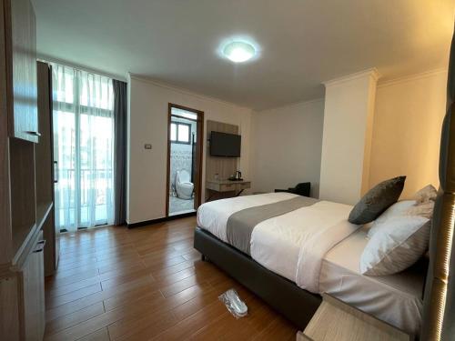 Ένα ή περισσότερα κρεβάτια σε δωμάτιο στο Hammer Luxury Guesthouse