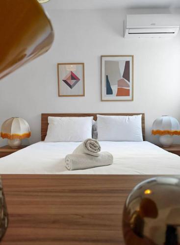 a bedroom with a bed with a towel on it at Sea Esta 1 in Il-Gżira