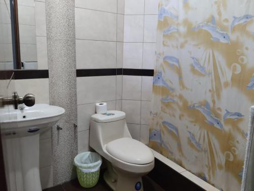a bathroom with a toilet and a sink at San José II in Nazca