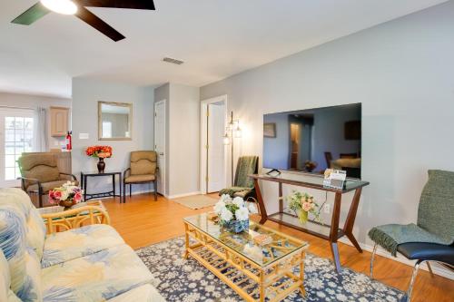 a living room with a couch and a table at Waterfront Lake Fork Getaway with Dock Access in Emory