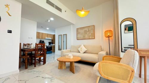 a living room with a couch and a table at Veridian Stay 2BR Oasis - Stylish & Modern in Abu Dhabi