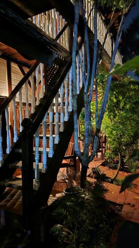 a wooden staircase leading up to a house at Greenheart Boutique Hotel in Paramaribo