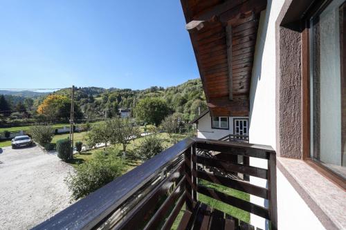 a balcony of a house with a view of a street at Casa Dintre Vai in Şimon