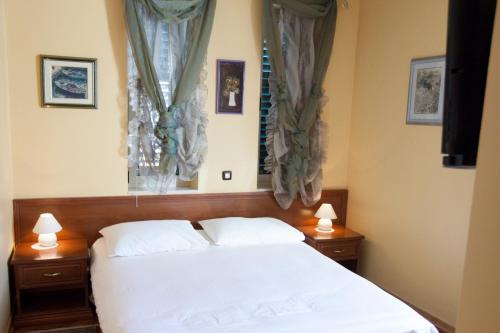 Кровать или кровати в номере Hotel Peristil