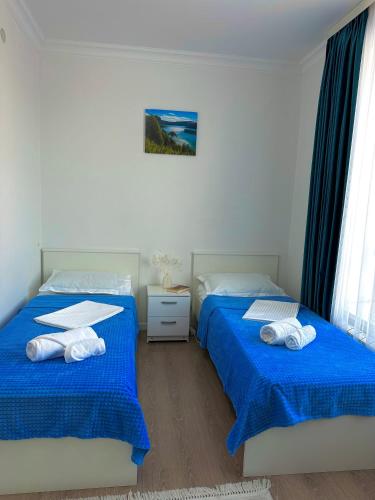 Llit o llits en una habitació de Promenade Burabay