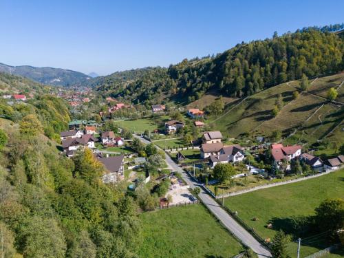an aerial view of a village in the hills at Casa Dintre Vai in Şimon