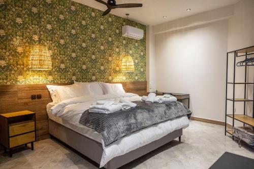 Ένα ή περισσότερα κρεβάτια σε δωμάτιο στο Trikala mall suites