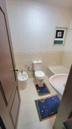 a small bathroom with a toilet and a sink at water house in Al Quwaysimah