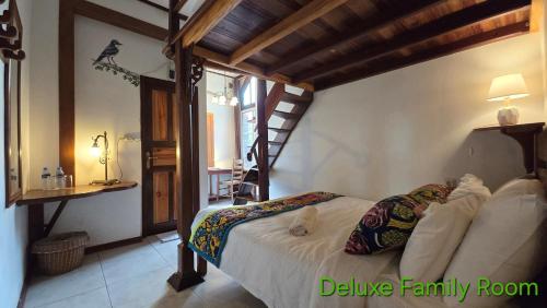 a bedroom with a bed in a room at Greenheart Boutique Hotel in Paramaribo