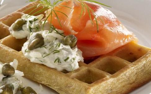 a waffle with a tomato and other food on a plate at Restaurante y Hostal San Paio in Santiago de Compostela