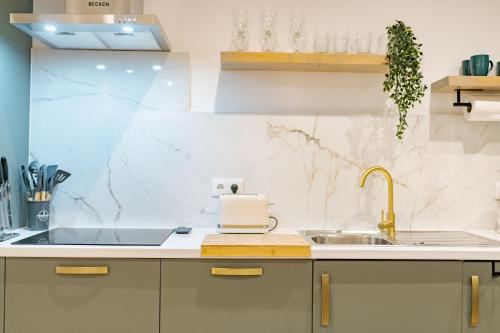 a kitchen with a sink and a counter top at Vienna apartment Alpine escape villa in Achada de Gaula
