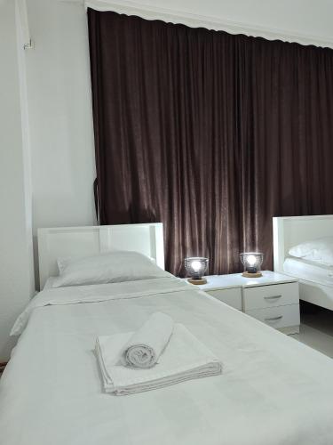 Ένα ή περισσότερα κρεβάτια σε δωμάτιο στο Apartments S&S