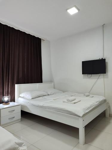 Ένα ή περισσότερα κρεβάτια σε δωμάτιο στο Apartments S&S