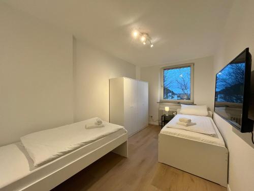 Ένα ή περισσότερα κρεβάτια σε δωμάτιο στο GuestHouse Bielefeld