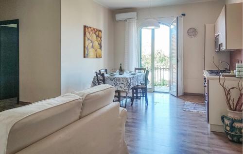 a living room with a couch and a table at Gorgeous Apartment In Trappitello in Trappitello