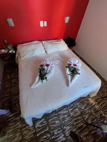 Ένα ή περισσότερα κρεβάτια σε δωμάτιο στο Nuevo Hotel Roble