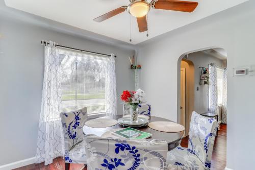 a dining room with a table and chairs and a ceiling fan at Peaceful Detroit Home with Yard 10 Mi to Downtown! in Detroit