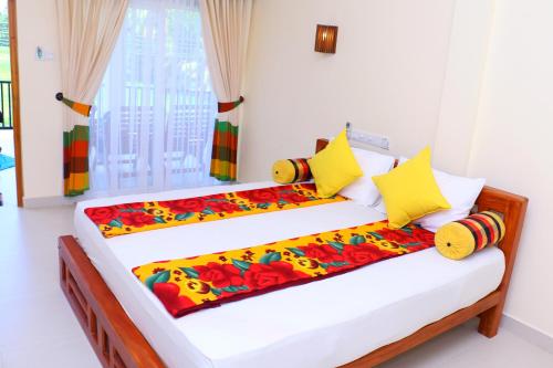 Postel nebo postele na pokoji v ubytování Nature Resort - Yala Safari Village