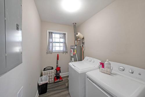 a laundry room with a washing machine and a window at Indian Lakes in Stone Mountain
