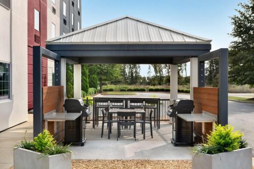 a gazebo with a table and chairs at Candlewood Suites Nogales by IHG in Nogales