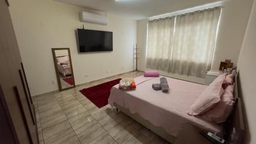 Katil atau katil-katil dalam bilik di Quarto aconchegante II -c