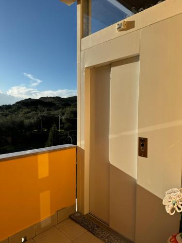 an open door to a balcony with a view at B&B Oliveto in Caserta