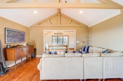 a living room with two white couches and a table at 5 Mi to Dtwn Pet-Friendly Gem in Blowing Rock! in Blowing Rock
