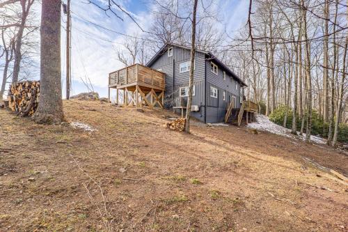 a gray house on a hill in the woods at 5 Mi to Dtwn Pet-Friendly Gem in Blowing Rock! in Blowing Rock
