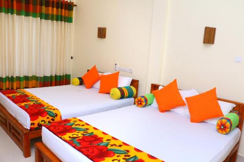 Postel nebo postele na pokoji v ubytování Nature Resort - Yala Safari Village